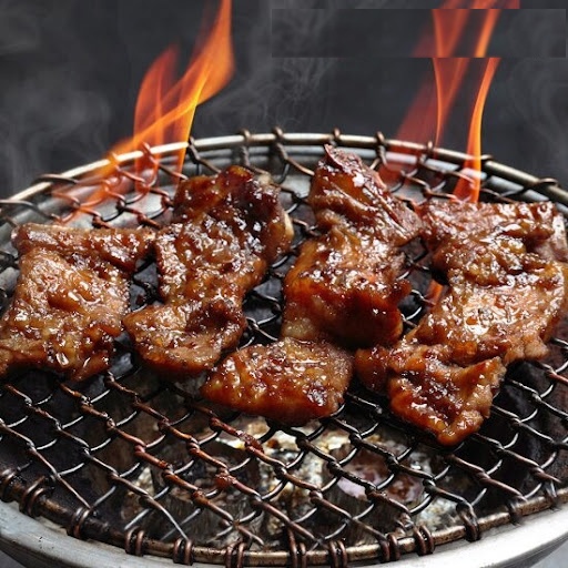 Galbi-gui on charcoal fire — smoke, char, immediacy
